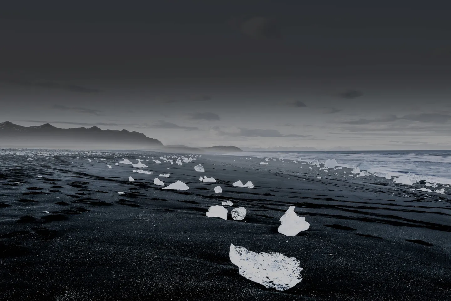 Icelandic landscape with glacier and black sand beach